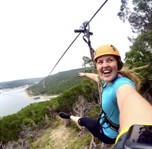Smiling girl down Zipline