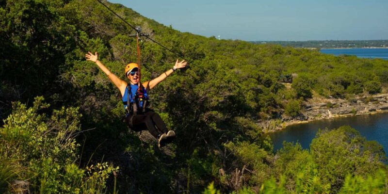 Zip liner headed down 1,600 feet of zipline with her arms wide open.