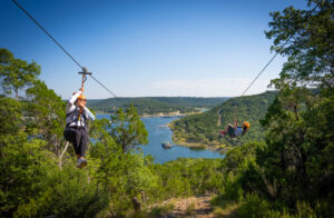 2 people Zipping down the Final Zipline of the tour